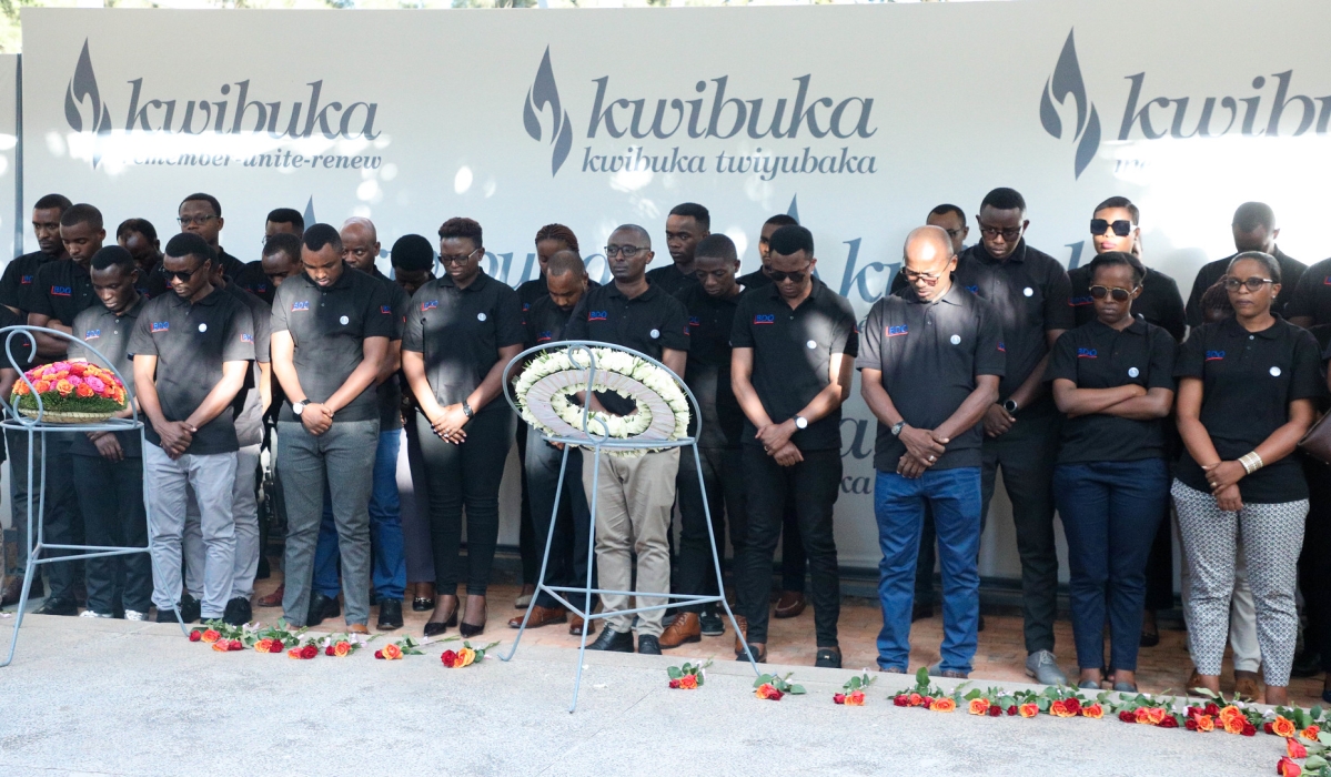 Management and staff of BDO EA Rwanda observe a moment of silence to  pay tribute to  victims of the Genocide against the Tutsi during their visit at Kigali Genocide Memorial on Thursday, June 8. All photos by Craish Bahizi.