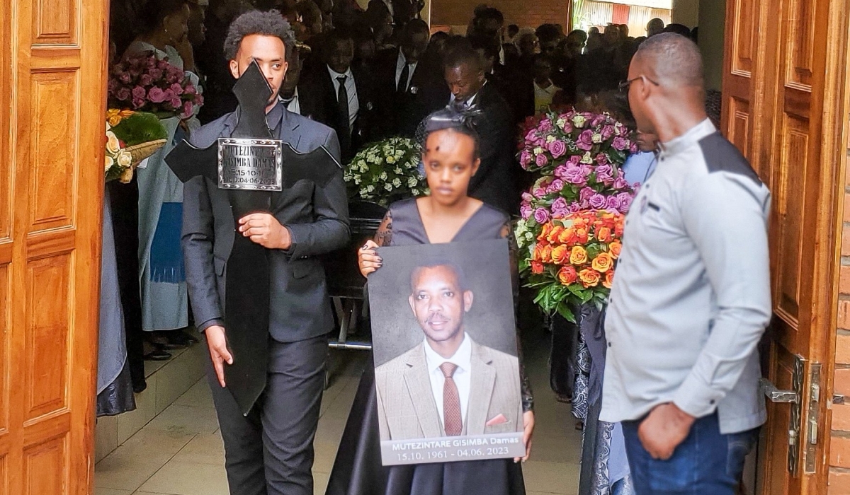 Children of Gisimba with his potrait at a requiem mass at, St Karoli Lwanga parish in Nyamirambo. Courtesy