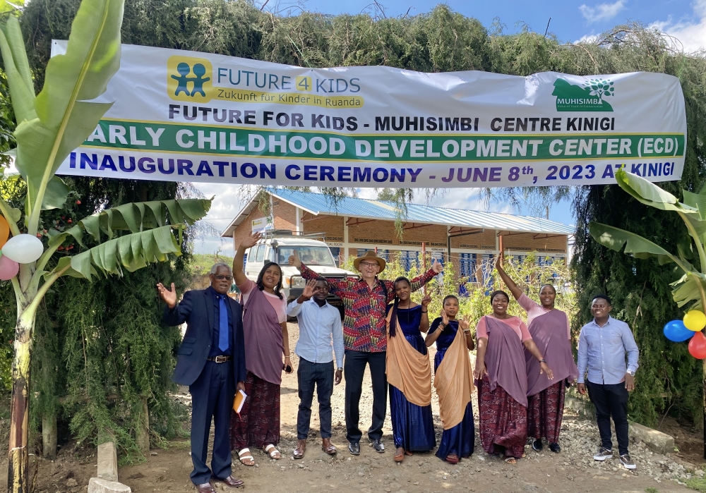 Otto Fischer, the Chairman of Future for Kids (4th from left) with Musanze residents pose for a photo  at the launch of the ECD in Kinigi Sector in Musanze. Courtesy.