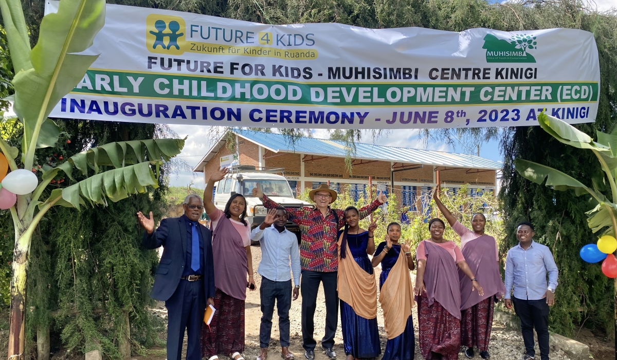 Otto Fischer, the Chairman of Future for Kids (4th from left) with Musanze residents pose for a photo  at the launch of the ECD in Kinigi Sector in Musanze. Courtesy.