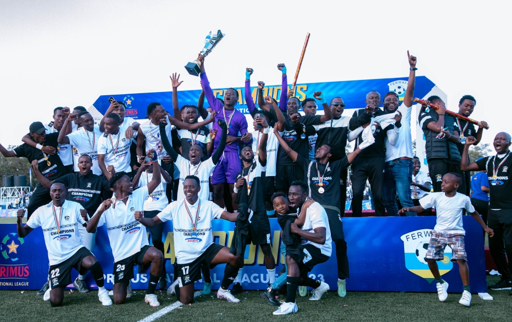 APR FC players celebrate the Primus National Football league title at Kigali Pele stadium. Photo by Craish Bahizi