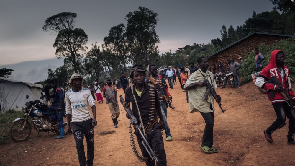 Militiamen of the  URDPC/CODECO armed group stand guard in the village of Wadda, Ituri Province, DR Congo Sept. 19, 2020. (VOA Africa photo)