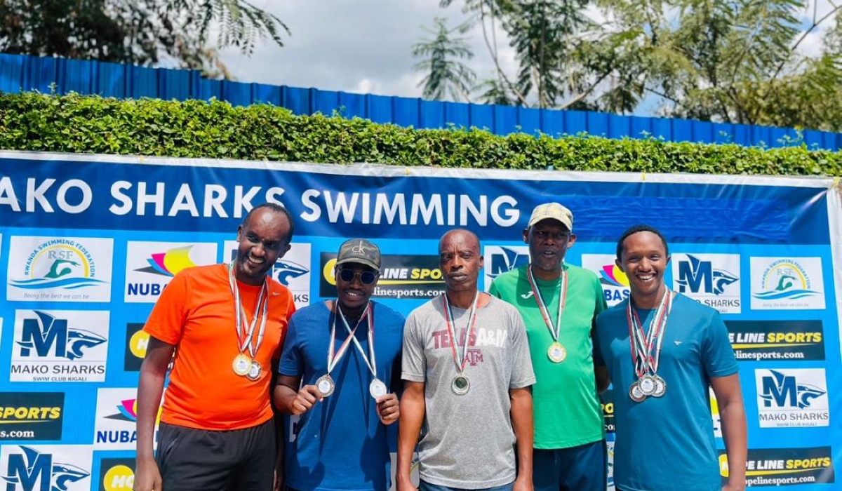 Hirwa (2nd left) poses for a photo alongside other winners after bagging two medals at the just-concluded Mako Sharks masters&#039; swimming contest-courtesy
