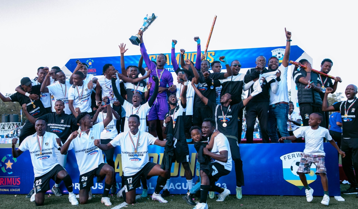 APR FC players celebrate the Primus National Football league title at Kigali Pele stadium. Photo by Craish Bahizi