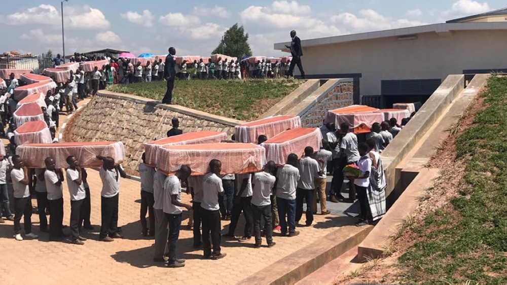 Mourners at a decent burial of the victims who had been previously buried in different mass graves in Ndora Sector ,Gisagara District, where Theonetse Niyongira, a fugitive deported from Malawi, killed many tutsi. File