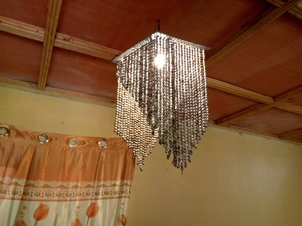 A beaded chandelier hangs inside a client&#039;s house. Courtesy photos