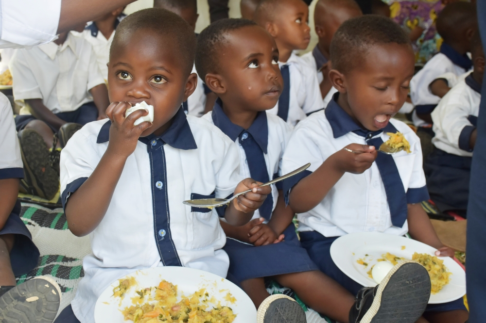 Children enjoy a meal during the launch of the two-year multisectoral plan that aims to reduce stunting in Musanze District. Courtesy photo