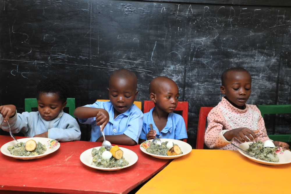 Children eat nutritious food in Nyamasheke District. Rwanda launched a comprehensive two-year plan for reducing stunting on June 12. Photo by Craish Bahizi