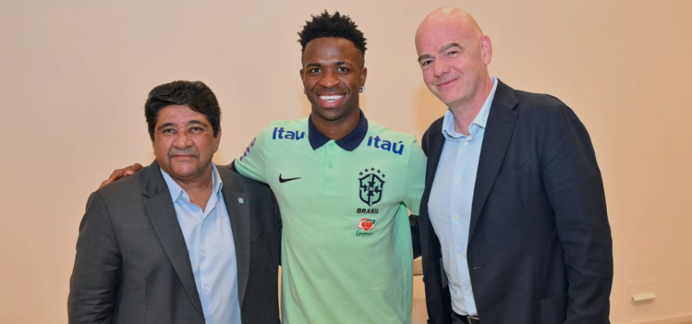 Brazilian Football Confederation (CBF) President Ednaldo Rodrigues, Brazil and Real Madrid forward Vinícius Júnior, and FIFA President Gianni Infantino pose for a photo after their meeting on Thursday, June 15, 2023. Infantino met Vinícius, the victim of several shocking racism incidents while playing for his club this season, and sent a powerful message, saying that football cannot go on when there is discrimination.