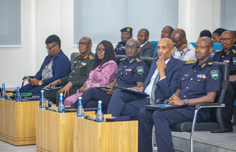 The NPC commandant (CP) Rafiki Mujiji, IGP Felix Namuhoranye, Justice Minister, Dr. Emmanuel Ugirashebuja, Governor-Northern Province, Dancille Nyirarugero, Maj Gen Eric Murokore, Regional Reserve Force Commander-Northern and RGB Chief Executive Officer, Usta Kaitesi, during the symposium.