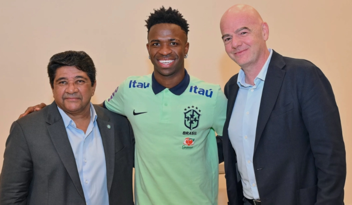 Brazilian Football Confederation (CBF) President Ednaldo Rodrigues, Brazil and Real Madrid forward Vinícius Júnior, and FIFA President Gianni Infantino pose for a photo after their meeting on Thursday, June 15, 2023. Infantino met Vinícius, the victim of several shocking racism incidents while playing for his club this season, and sent a powerful message, saying that football cannot go on when there is discrimination.