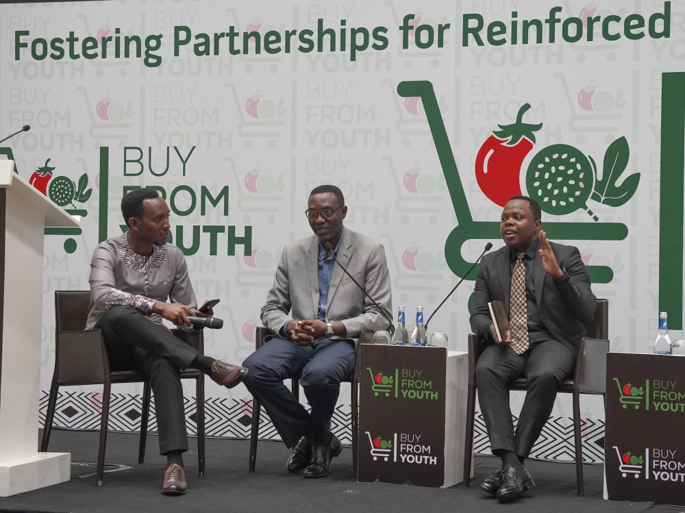Dr Abdallah Utumatwishima, Rwanda’s Minister of Youth (R), speaks during a panel discussion.He emphasized that it’s time for young people in agriculture to shine, be supported, and be recognised for the transformation.
