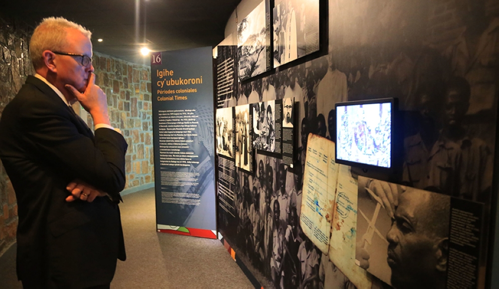 A visitor during a tour of  the Kigali Genocide Memorial Museum  to learn more about Rwandan history. Photo by Sam Ngendahimana