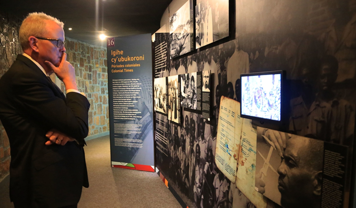 A visitor during a tour of  the Kigali Genocide Memorial Museum  to learn more about Rwandan history. Photo by Sam Ngendahimana