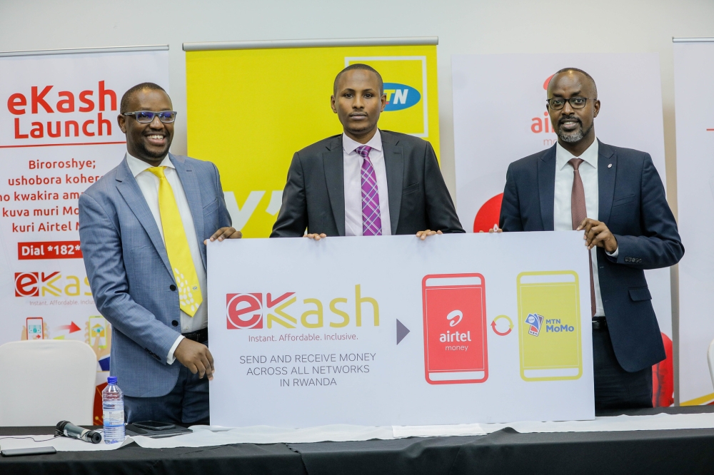 Christian Kajeneri, Fintech Strategy, Products and Services at Mobile Money; Mathieu Rwiyereka, Founder, Managing Consultant Trustees Ltd; Jean-Claude Gaga, Managing Director of Airtel Money, during the launch Ekash on May 26, 2022. File