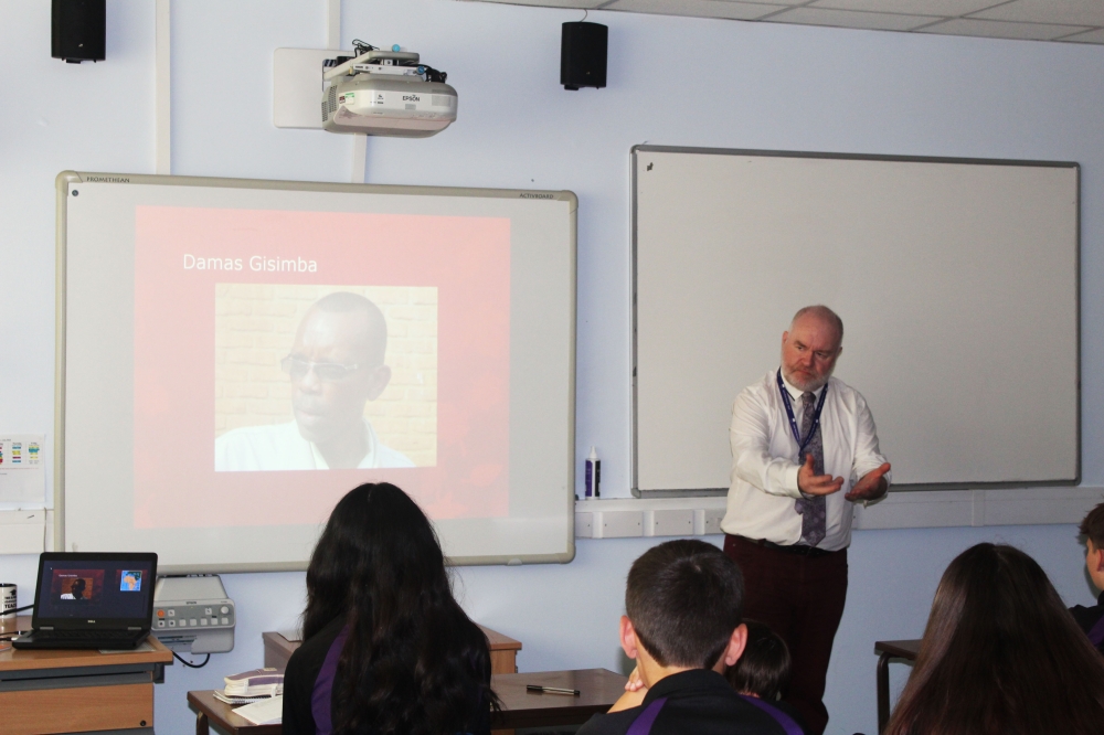 Jonathan Salt, a teacher of Religion, Philosophy, and Ethics at Jack Hunt School, Peterborough in the UK while screening a documentary on Damas Gisimba. Courtesy