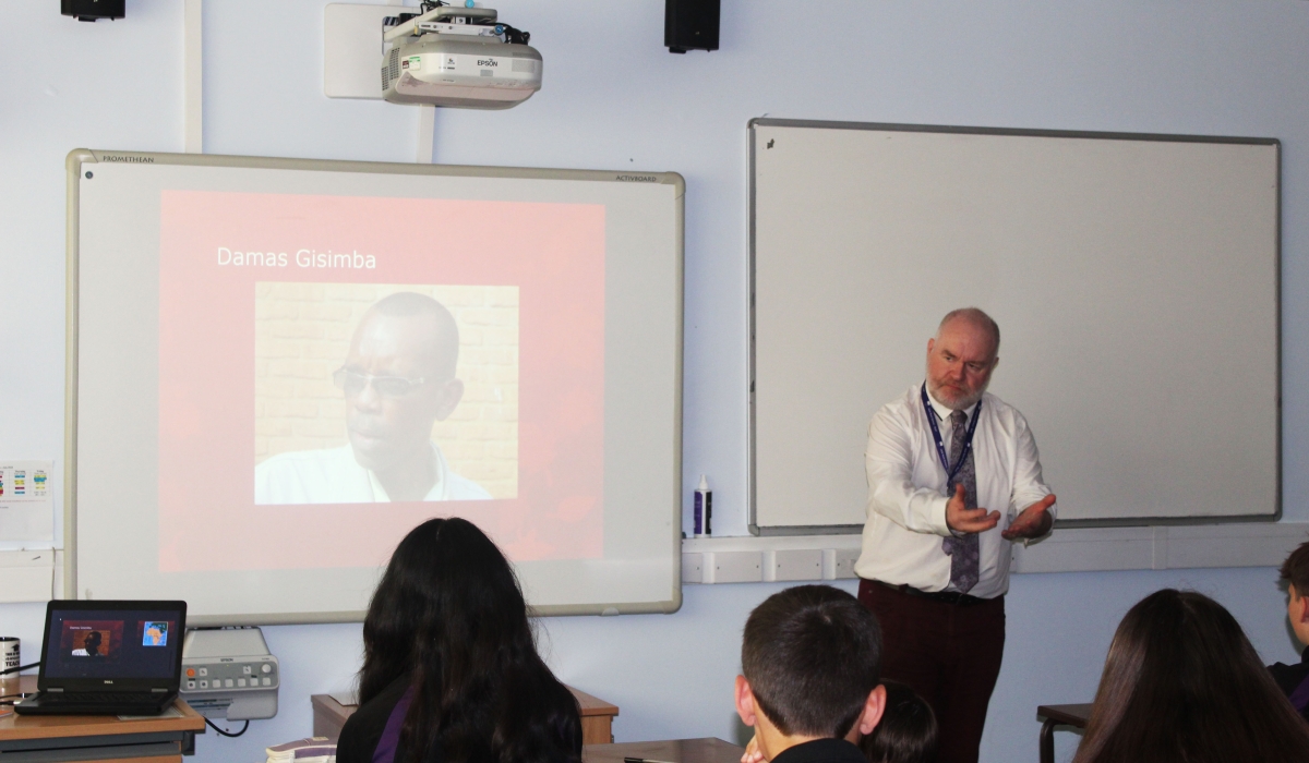 Jonathan Salt, a teacher of Religion, Philosophy, and Ethics at Jack Hunt School, Peterborough in the UK while screening a documentary on Damas Gisimba. Courtesy