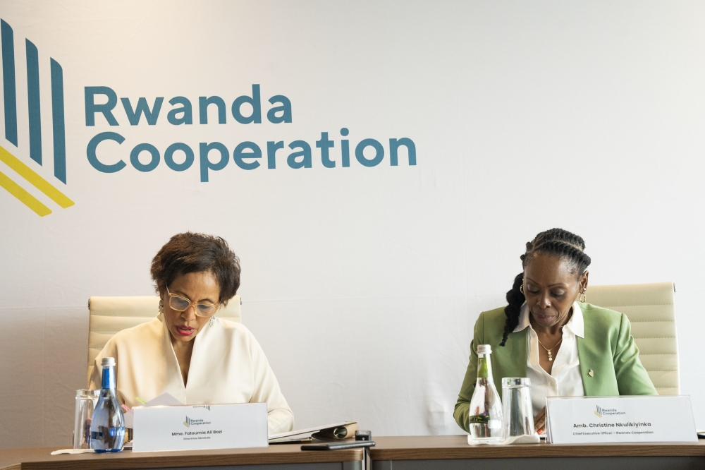 Rwanda Cooperation CEO, Ambassador Christine Nkulikiyinka, and ACCI’s Director General, Fatoumia Ali Bazi sign the agreement in Kigali on June 21. Photos by Emmanuel Dushimimana