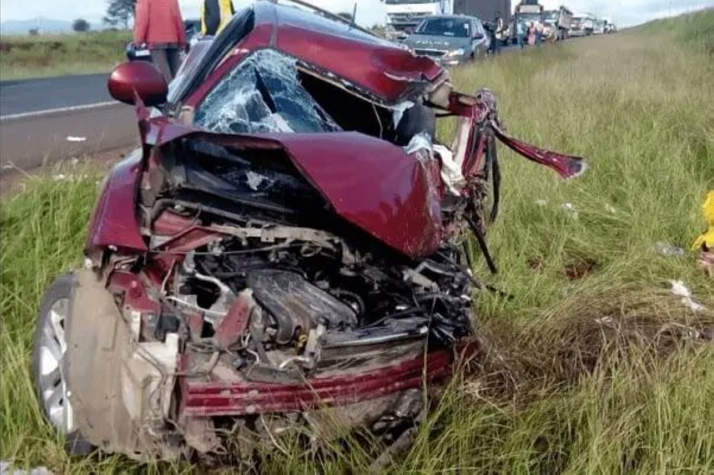 A scene of the accident where a bus collided with this car (pictured here) that caused the death of Pastor Theogene Niyonshuti and other two people  in Kabale, Uganda on Thursday, June 22. According to the new information, the two people who died in a road accident along with pastor Theogene Niyonshuti, have been identified. Courtesy