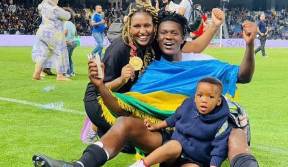 Imanishimwe celebrates his 2022/23 Moroccan Botola League winning medal with his family.