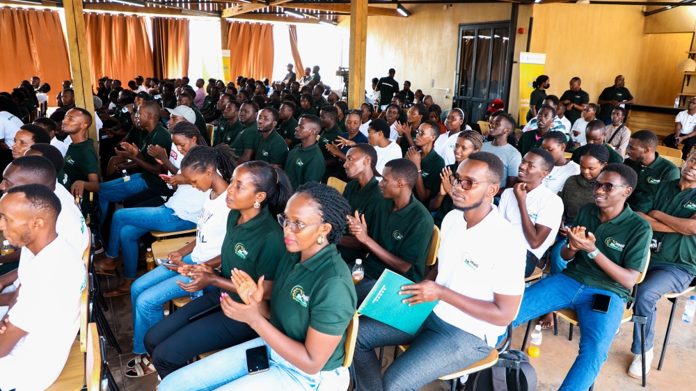 Participants follow the proceedings of the event 
