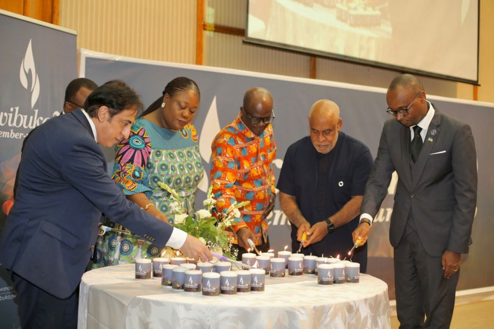 Officials light candles during the commemoration of the Genocide Against the Tutsi in Accra in Ghana. Courtesy