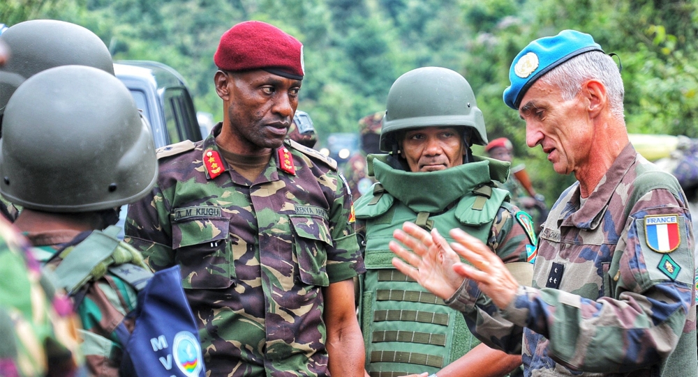 EACRF commander Major General Aphaxard Kiugu and MONUSCO Deputy Force Commander Major General Benoît Chavanat in a conversation during the reconnaissance mission. Courtesy