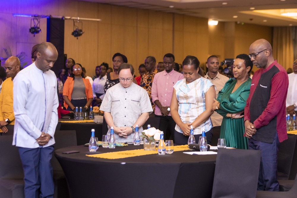 Delegates observe a moment of silence to pay tribute to victims of the Genocide against the Tutsi during the launch of  "N’Accepte Pas de Mourir", the French version of her debut memoir, "Do Not Accept to Die," originally released in April 2022. Courtesy