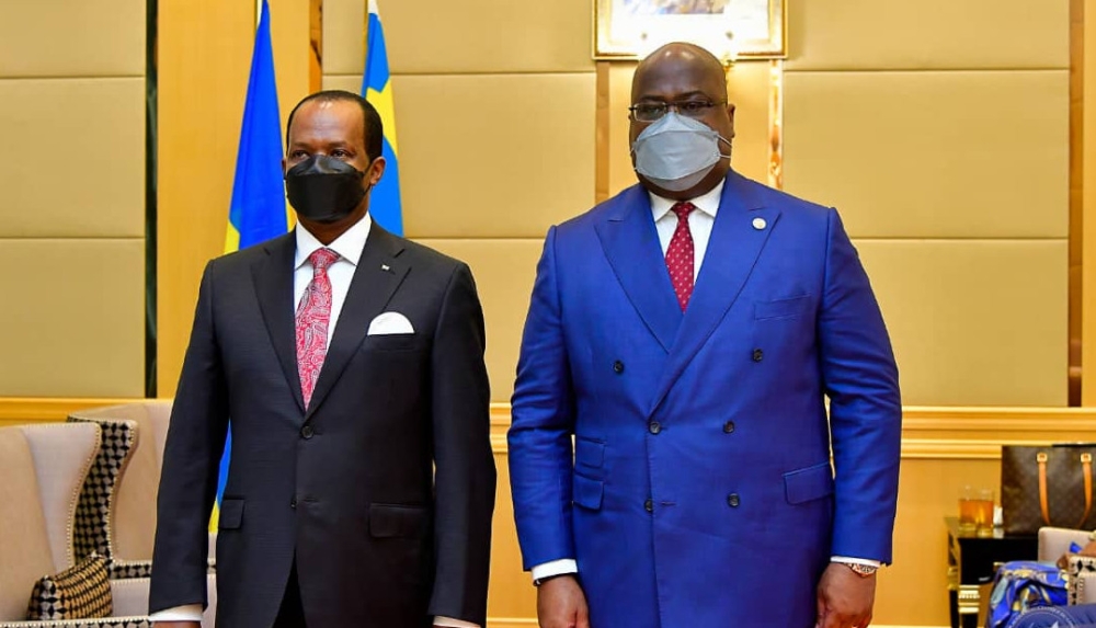 Vincent Karenga (left), then the Rwandan ambassador to DR Congo, with President Felix Tshisekedi in 2020. Net photo