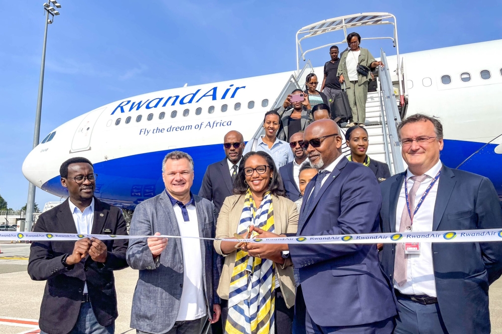 RwandAir CEO Yvonne Makolo with  French ambassador to Rwanda Antoine Anfré (L) and Ambassador  of Rwanda to France, François Nkulikiyimfura (R) with other delegates officially inaugurate the national carrier&#039;s flights to France on Tuesday, June 27.