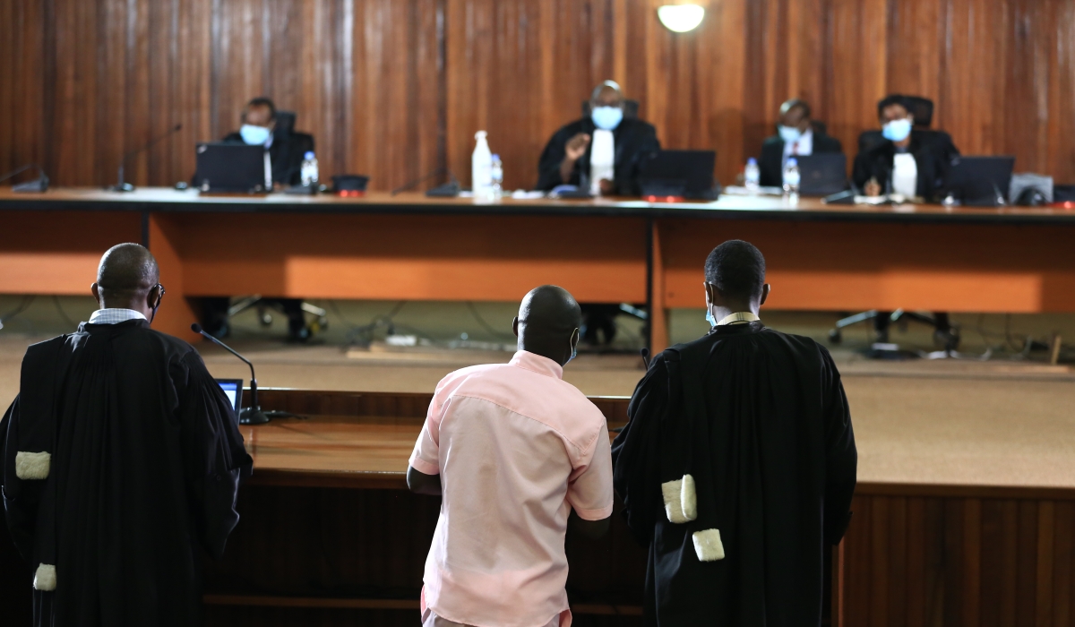 A prisoner with his lawyers during a hearing session during FLN trial in Kigali on February 26, 2021. Sam Ngendahimana