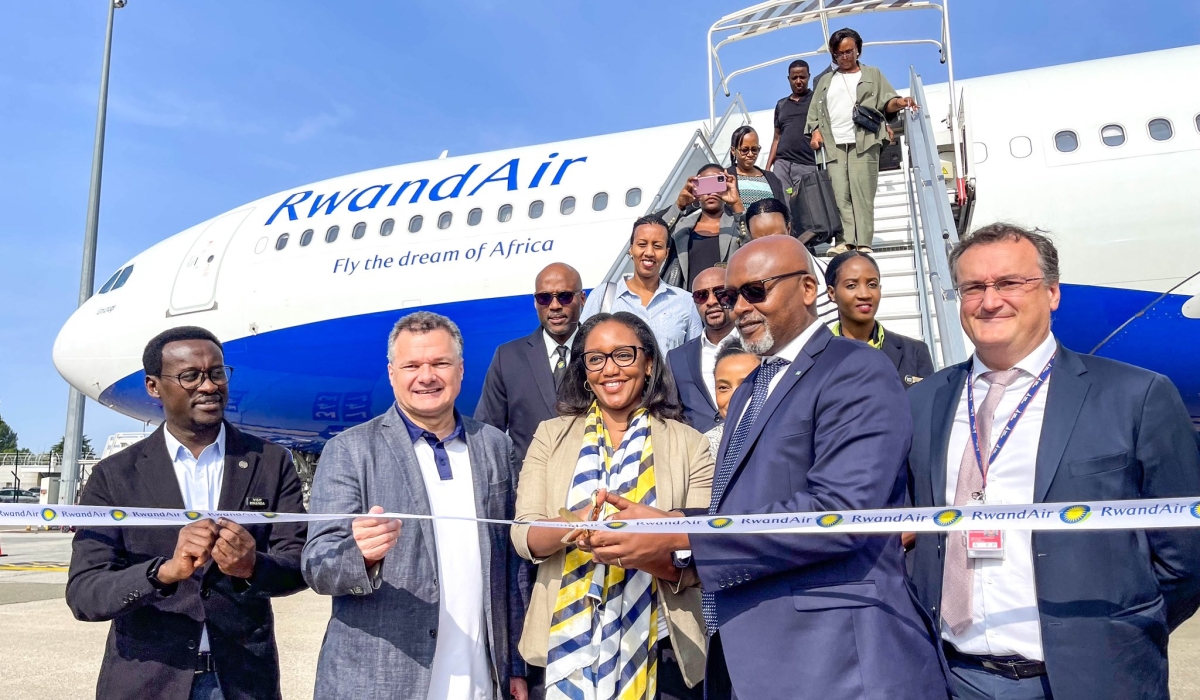 RwandAir CEO Yvonne Makolo with  French ambassador to Rwanda Antoine Anfré (L) and Ambassador  of Rwanda to France, François Nkulikiyimfura (R) with other delegates officially inaugurate the national carrier&#039;s flights to France on Tuesday, June 27.