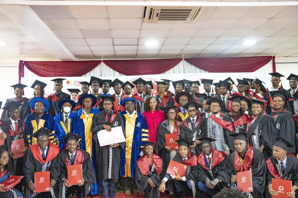 Officials and graduates pose for a group photo  during the graduation ceremony of 57 graduates on June 27. All photos by Emmanuel Dushimimana