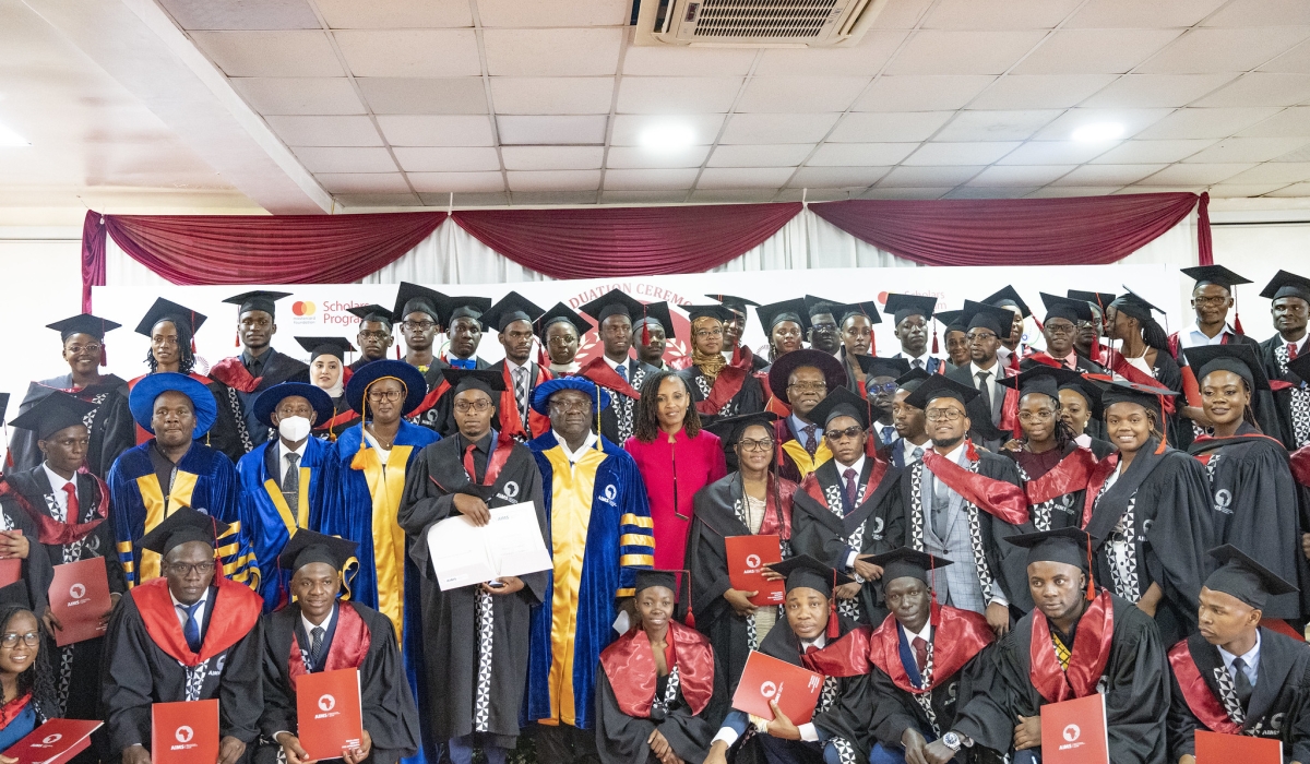 Officials and graduates pose for a group photo  during the graduation ceremony of 57 graduates on June 27. All photos by Emmanuel Dushimimana