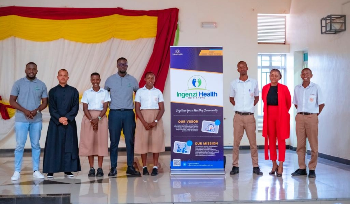 Ingenzi Health Initiative co-founders pose for a group photo with students of Collège Saint André Nyamirambo after the Ingenzi talks.