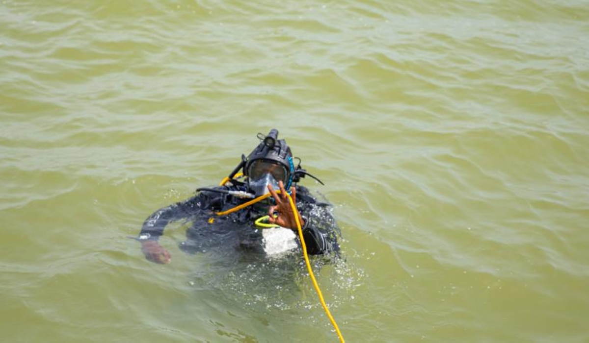 A marine police officer makes a countdown before taking a dive