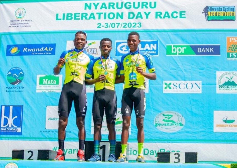 Moise Mugisha, the winner of Nyaruguru Liberation Day Race, along with the first runner-up Etienne Tuziyere (L) and second runner-up Eric Manizabayo, during the awards ceremony in Nyaruguru District, on Monday, July 3.