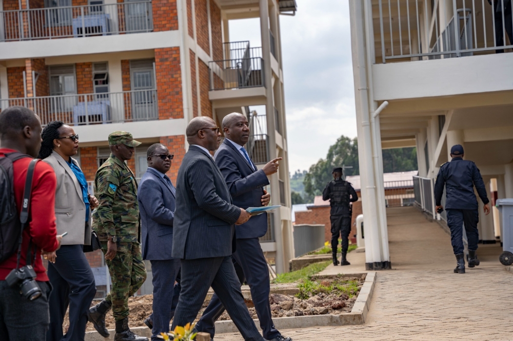 Prime Minister Edouard Ngirente flanked by Minister of Local Government Jean Claude Musabyimana and other officials during a guided tour of the newly inaugurated Rugerero Integrated Model Village in Rubavu  District on July 4. All photos by Emmanuel Dushimimana