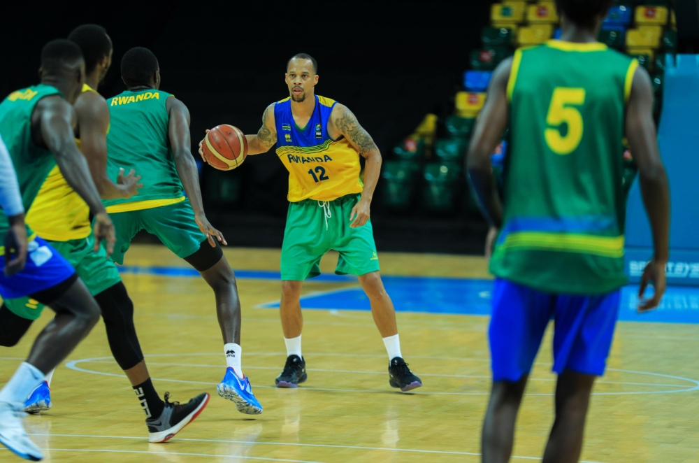 Rwanda&#039;s shooting guard Kenneth Gasana with the ball during a training session at BK Arena on February 8, 2021 (File)