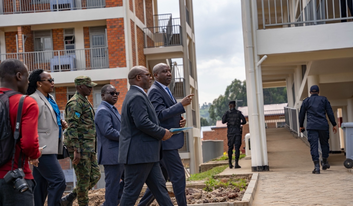 Prime Minister Edouard Ngirente flanked by Minister of Local Government Jean Claude Musabyimana and other officials during a guided tour of the newly inaugurated Rugerero Integrated Model Village in Rubavu  District on July 4. All photos by Emmanuel Dushimimana