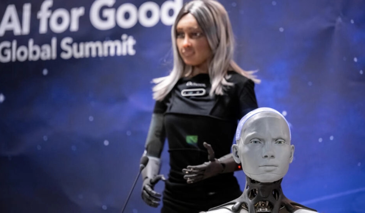 Humanoid social robots Mika and Ameca fielded questions at the AI for Good Global Summit press conference © Fabrice COFFRINI / AFP