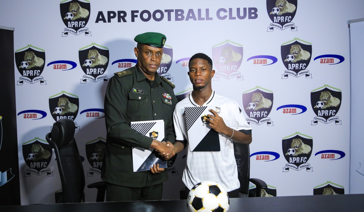 APR chairman Lt Col Charles Karasira and Burundian international Danny Ndikumana during the signing event. Courtesy