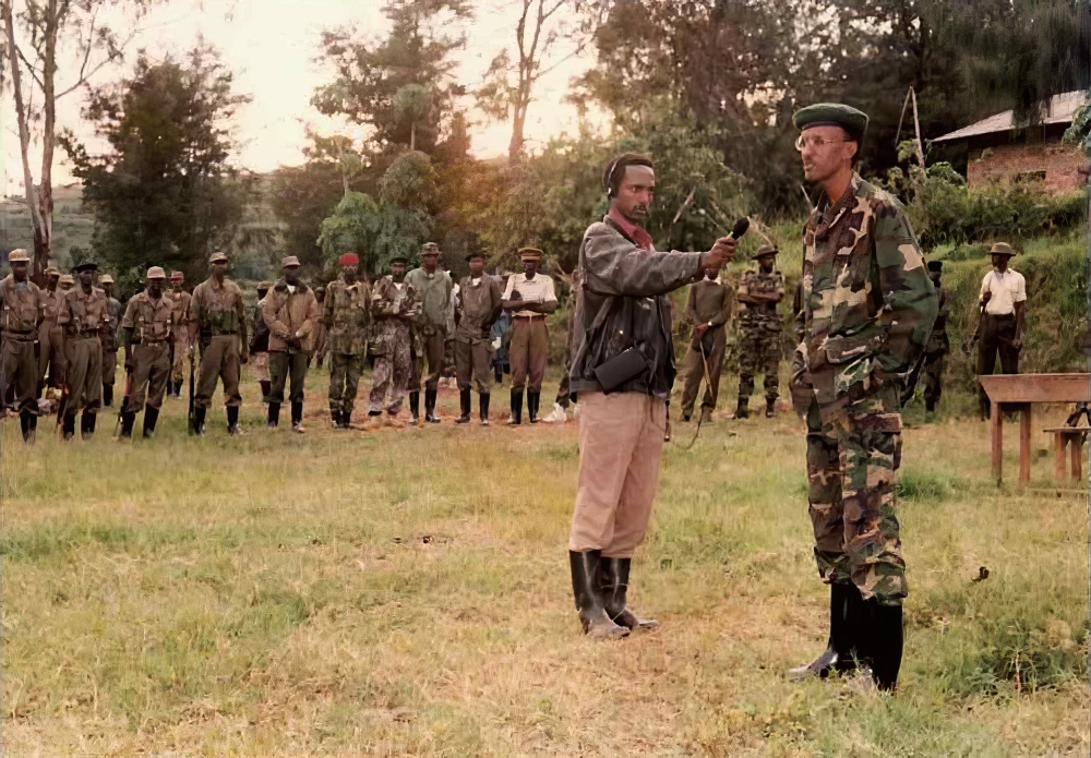 The Chairman of the RPA High Command, Paul Kagame, speaks to Muhabura Radio reporter Anaclet Kalibata during the liberation struggle. COURTESY