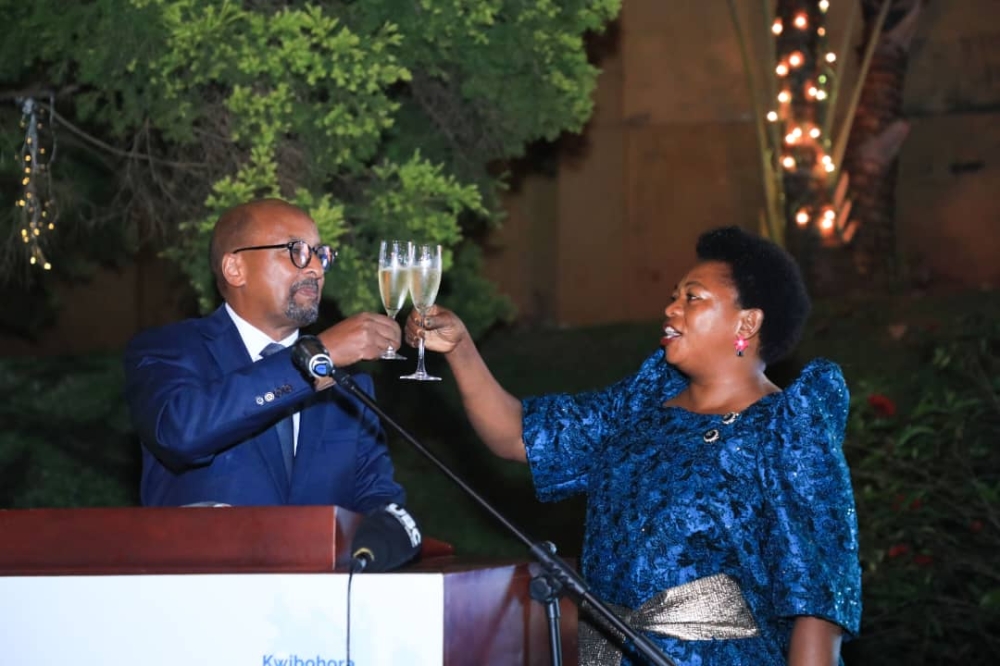 Rwanda’s High Commissioner to Uganda, Joseph Rutabana, and the guest of honour, Uganda’s Minister of State for Trade Industry and Cooperatives, Harriet Ntabbazi, toast as they celebrate the 29th anniversary of Rwanda’s liberation, at the former’s residence in Kololo, Kampala, on July 7, 2023. Courtesy