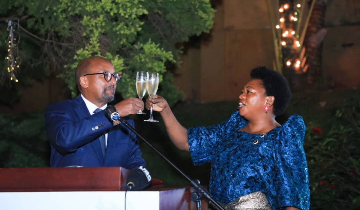 Rwanda’s High Commissioner to Uganda, Joseph Rutabana, and the guest of honour, Uganda’s Minister of State for Trade Industry and Cooperatives, Harriet Ntabbazi, toast as they celebrate the 29th anniversary of Rwanda’s liberation, at the former’s residence in Kololo, Kampala, on July 7, 2023. Courtesy