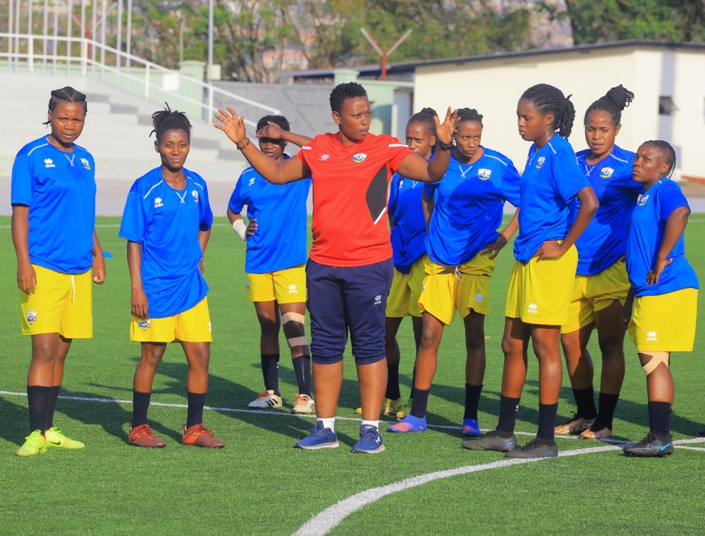 Amavubi women&#039;s team head coach Grace Nyinawumuntu gives instructions to the players during a training session at Kigali Pele Stadium. COURTESY