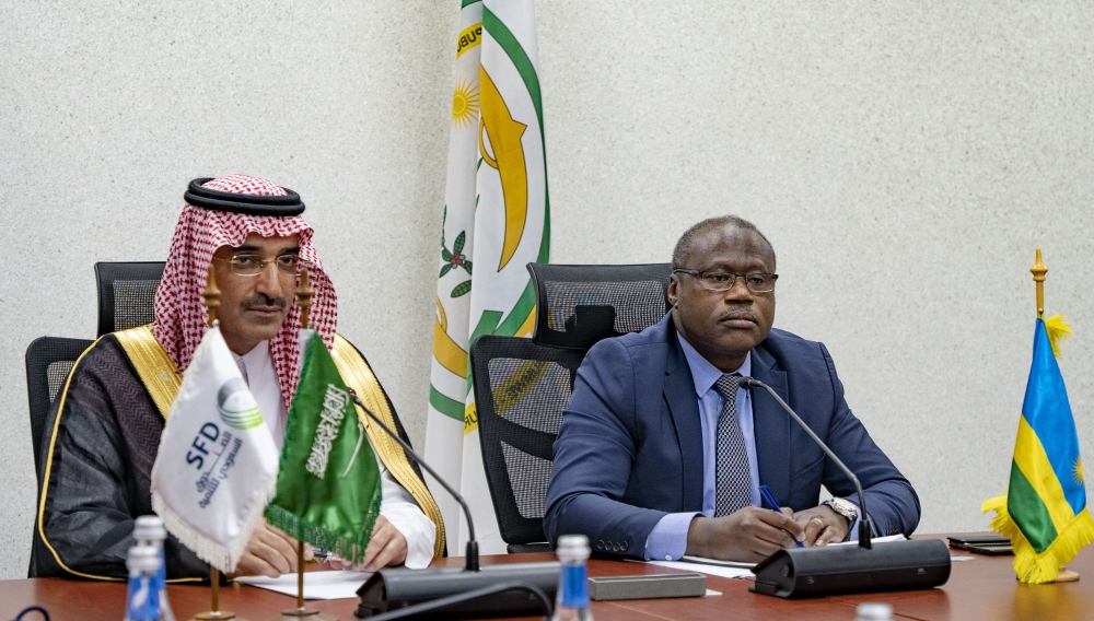 Minister of Finance Uzziel Ndagijimana and  Sultan bin Abdulrahman Al-Marshad, Chief Executive Officer of SFD during the  signing ceremony in Kigali on Tuesday, July 11. Photos by Emmanuel Dushimimana
