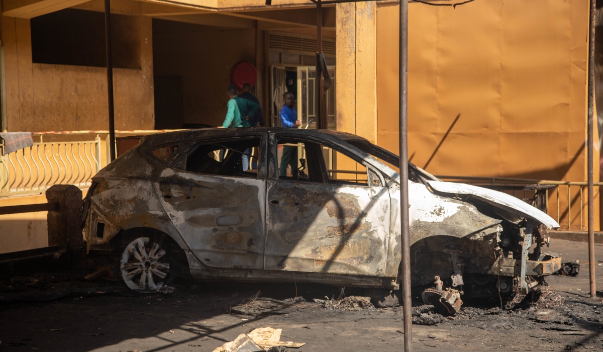 Fire engulfed one car and slightly damaged three others in an area called ‘mu Cyerekezo garage’ in Gatsata sector, Gasabo District, on July 11. Photo by Dan Gatsinzi