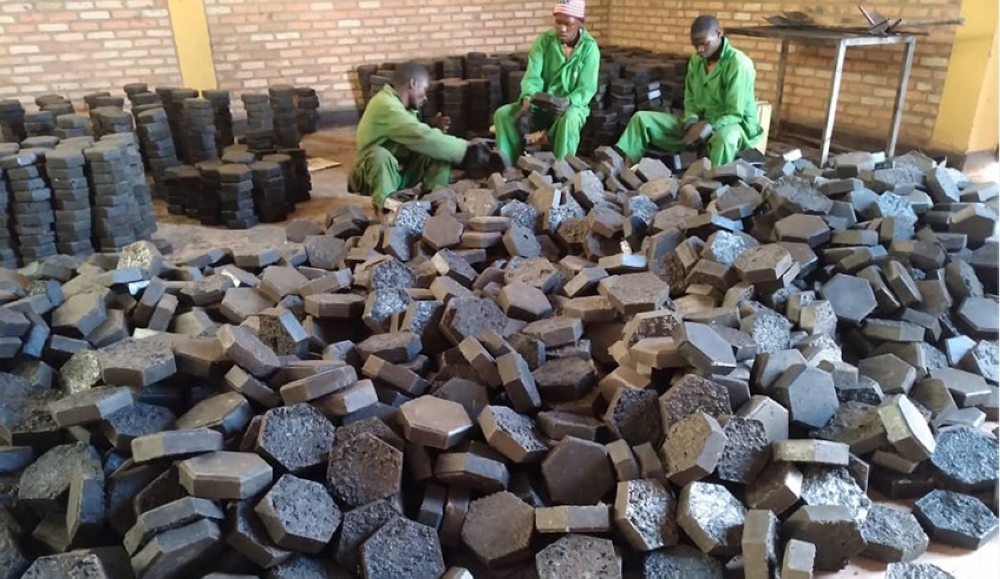 Workers sort some pavers made from plastic waste at Green Care Rwanda Ltd, Huye District based company.