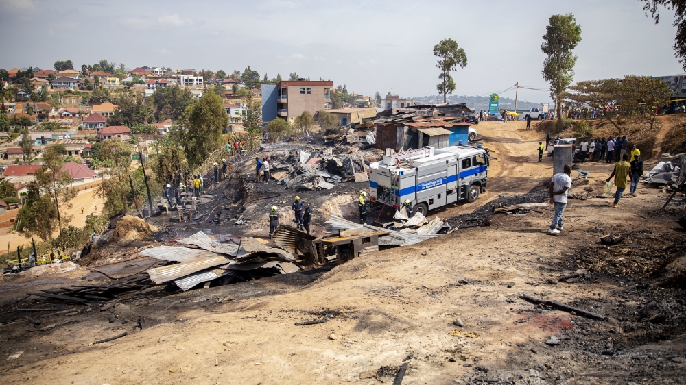 Rwanda National Police (RNP) Fire and Rescue Brigade officers helped put out a massive fire that gutted workshops in the Zindiro area of Kigali on Tuesday, July 11. Photo by Christianne Murengerantwari.